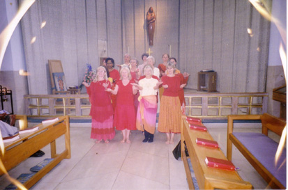 Group of twenty dancers standing close together