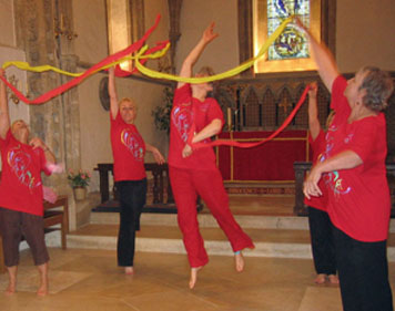 Dancers with streamers. One dancer jumping